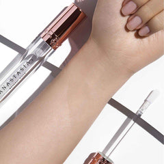 Anastasia Beverly Hills Crystal Gloss worn on lips with glass-like shine.