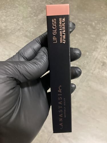 Anastasia Beverly Hills lip gloss caramel cap close-up highlights sleek brush and shine.