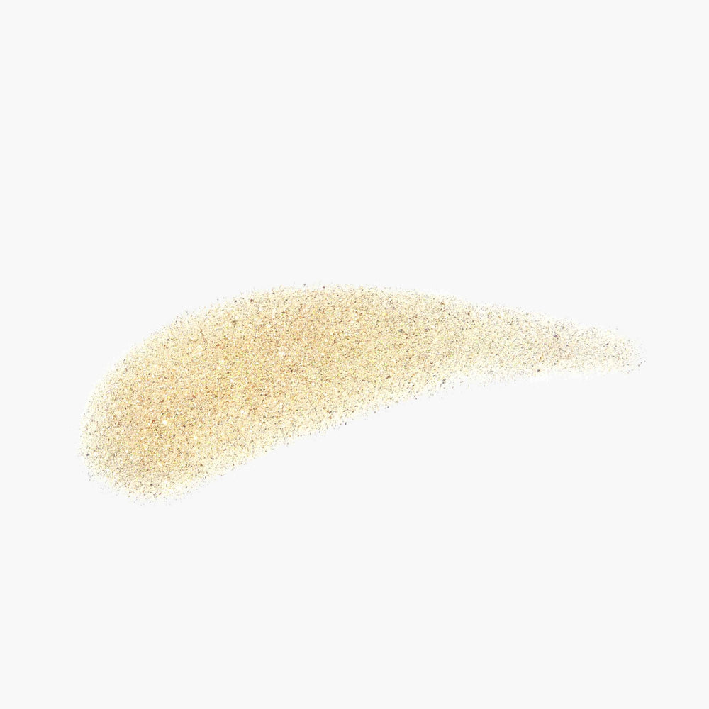 Anastasia Beverly Hills Shimmer Body Oil Gold applied on skin for radiance