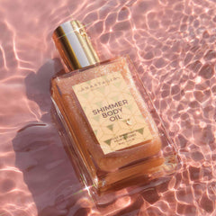 Anastasia Beverly Hills Shimmer Body Oil Rose Gold glow on skin under light