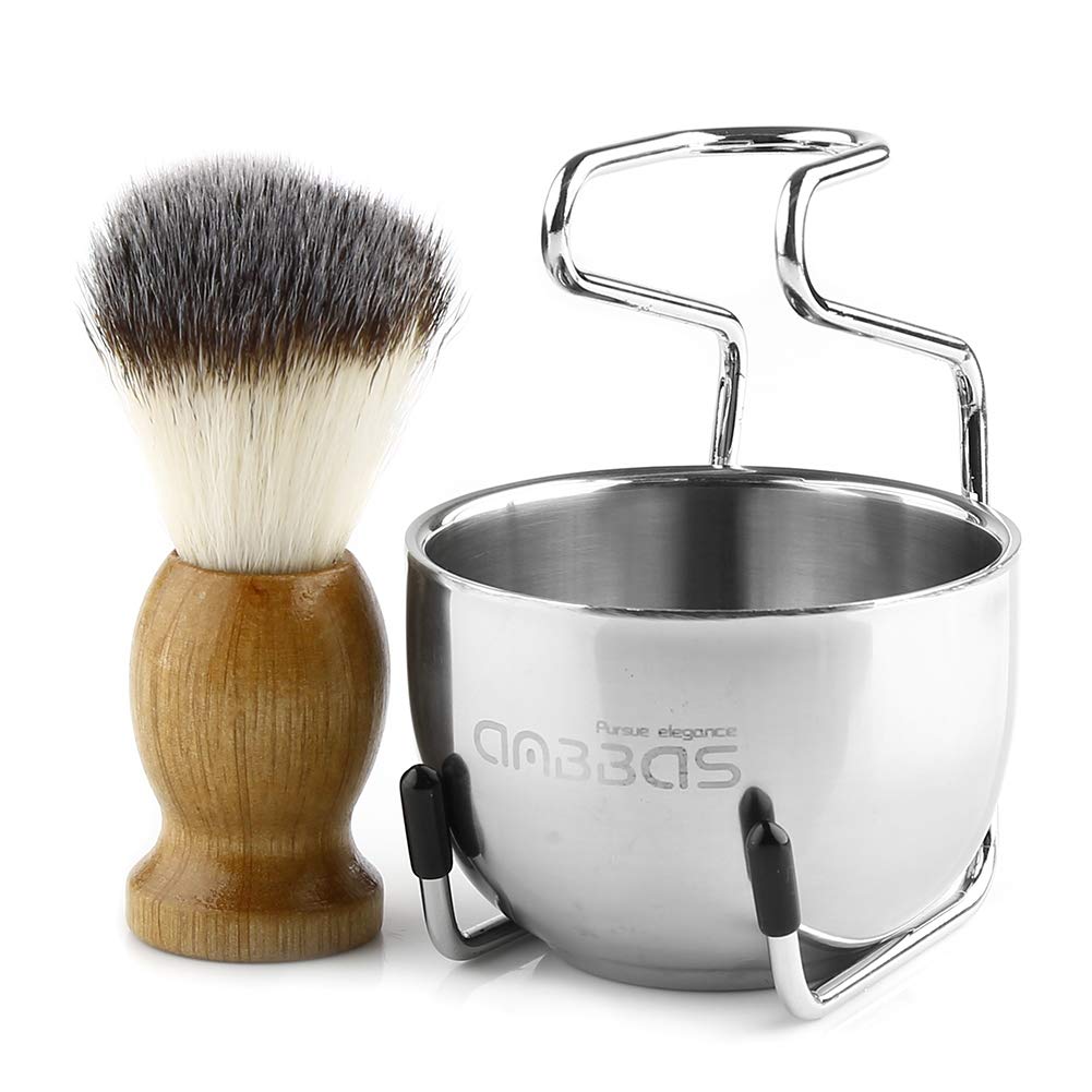 Anbbas brush next to razor showing scale and travel-friendly size advantage