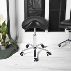 Antlu Saddle Stool side view highlighting adjustable height for varied workflows
