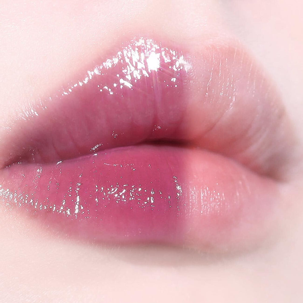 AOU Glowy Tint Balm on lips provides natural gloss and a fuller look.