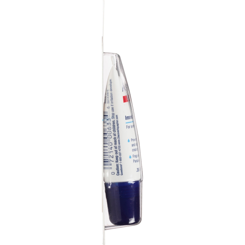Person using Aquaphor outdoors protecting lips in cool windy conditions