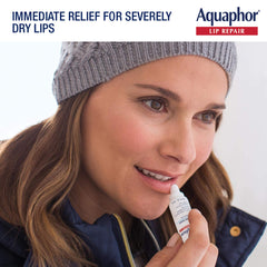 Aquaphor tube next to a ruler showing 0.35 fl oz compact travel-friendly size