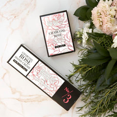 Archipelago Botanicals Charcoal Rose Hand Crème jar opened to reveal creamy formula.