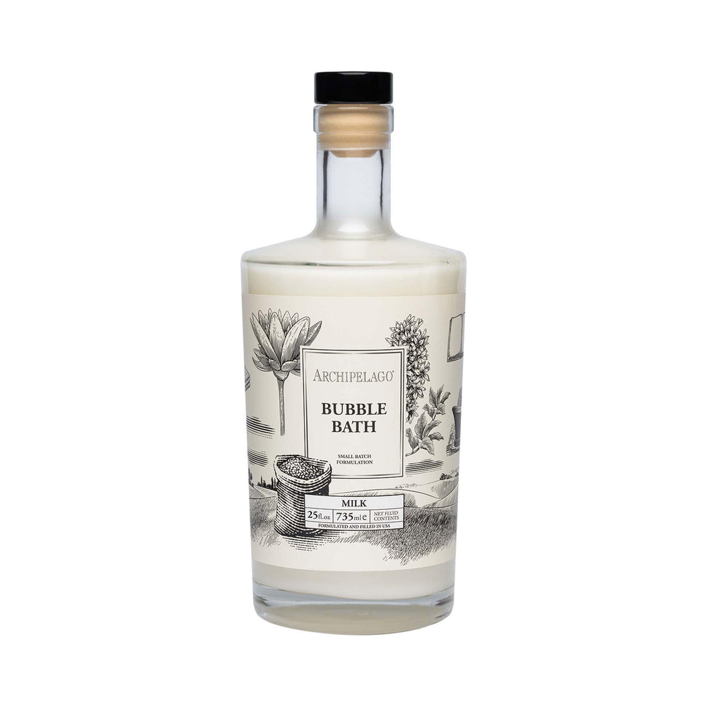 Archipelago Botanicals Luxury Milk Bubble Bath bottle pour shows hydrating bubbles for a calming soak