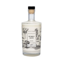 Archipelago Botanicals Luxury Milk Bubble Bath bottle pour shows hydrating bubbles for a calming soak