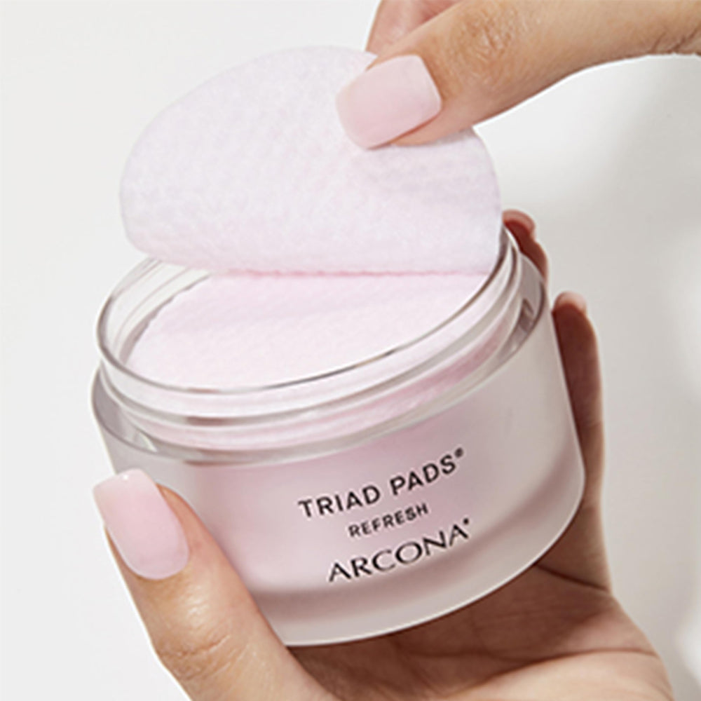 ARCONA Triad Pads being wiped on cheek demonstrates gentle tone and even skin tone potential.