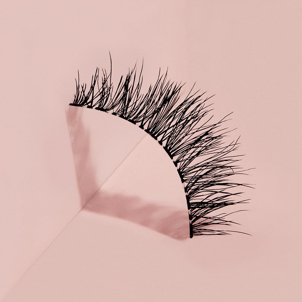 Ardell Naked Lashes 424 double-layer curl lifts define eyes.