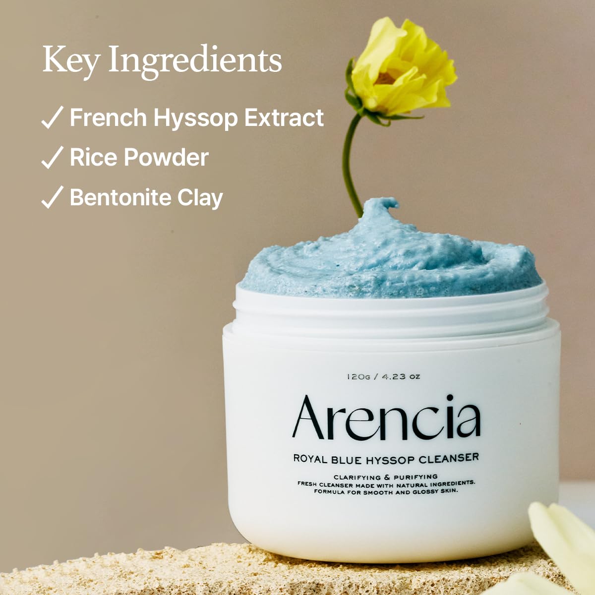 ARENCIA Hyssop Brightening Scrub applied to skin for gentle cleansing in motion.