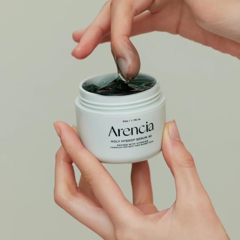 Arencia Glow Hyssop texture close-up reveals rich green serum for luminous finish.