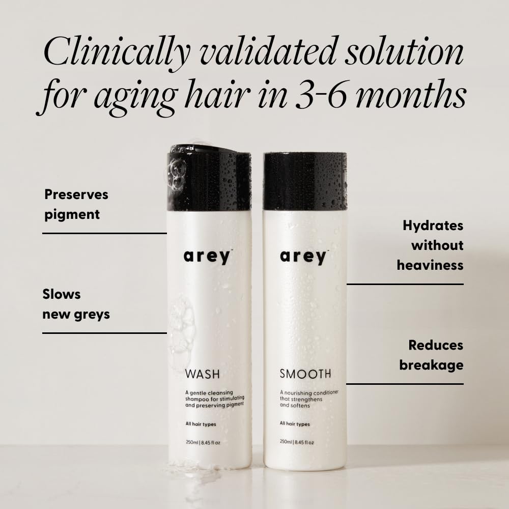 Arey Shower Duo shampoo bottle closeup showing cleansing action