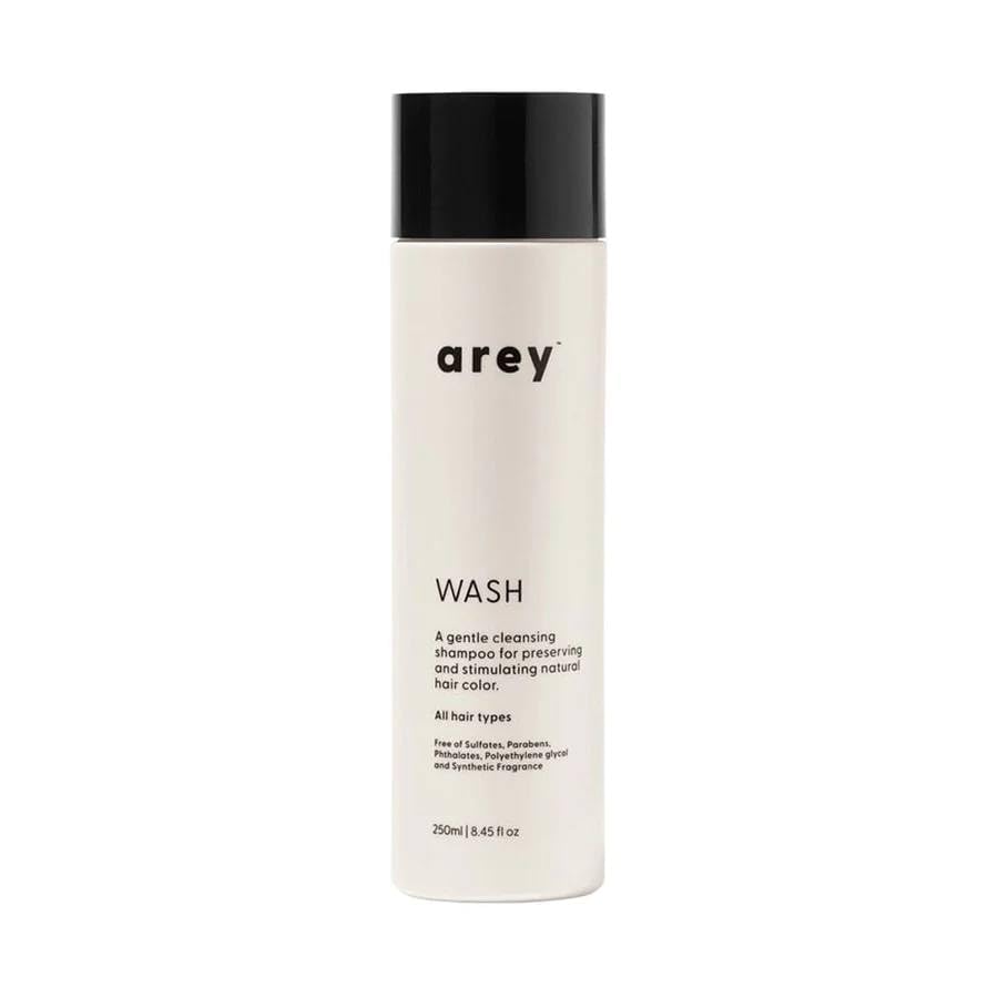 Arey Wash Shampoo bottle featuring Mela-9 Complex for pigment preservation and scalp health