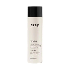 Arey Wash Shampoo bottle featuring Mela-9 Complex for pigment preservation and scalp health