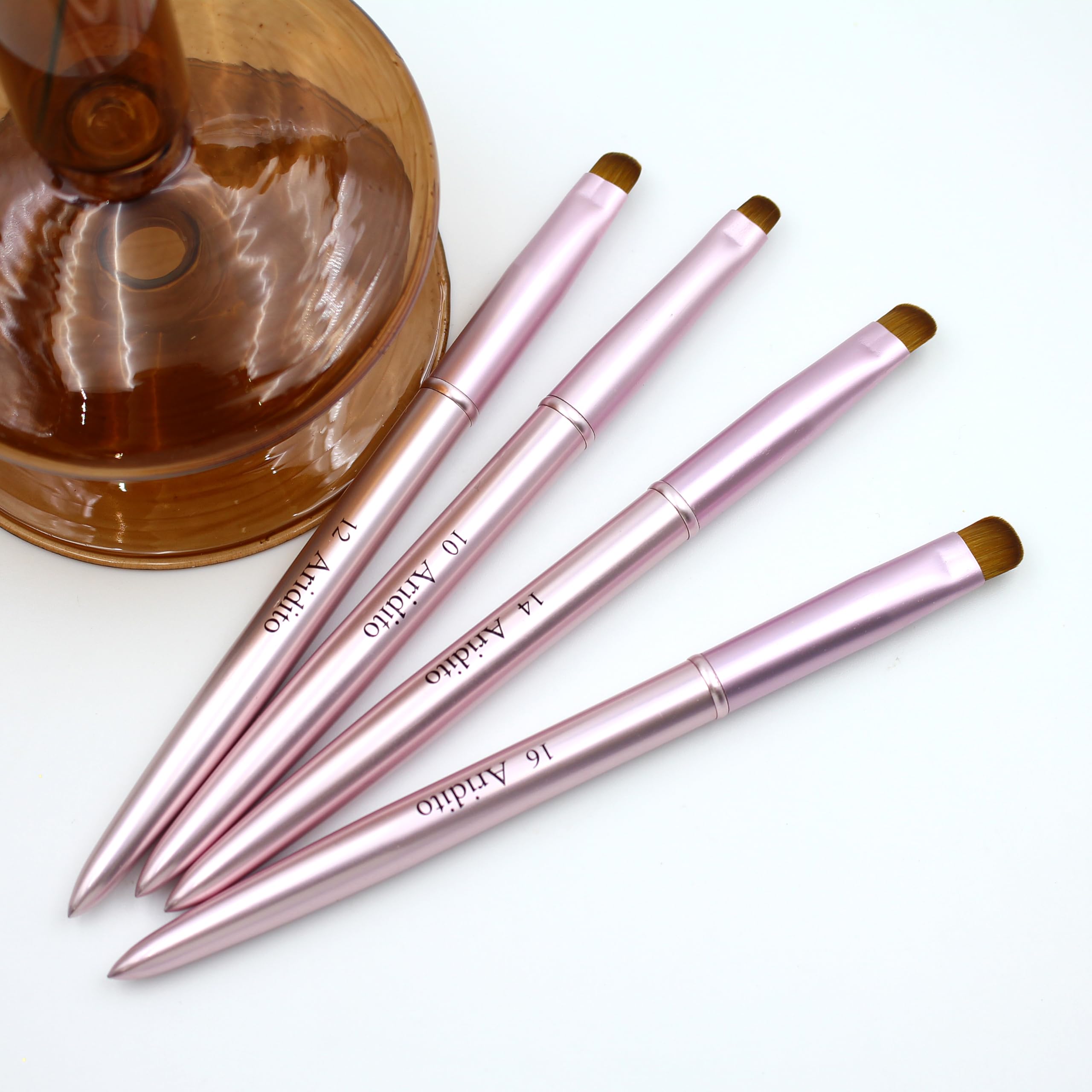 Aridito French tip brush closeup shows precise bristle control for crisp edges.