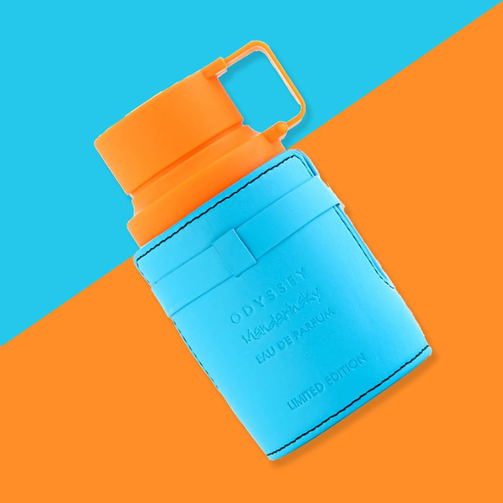 Armaf Odyssey Mandarin Sky juice in glass reveals warm amber tone and presence.