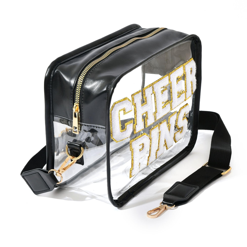 Ashpin Cheer Pins Bag side-straps shows adjustable strap for crossbody or clutch wear.