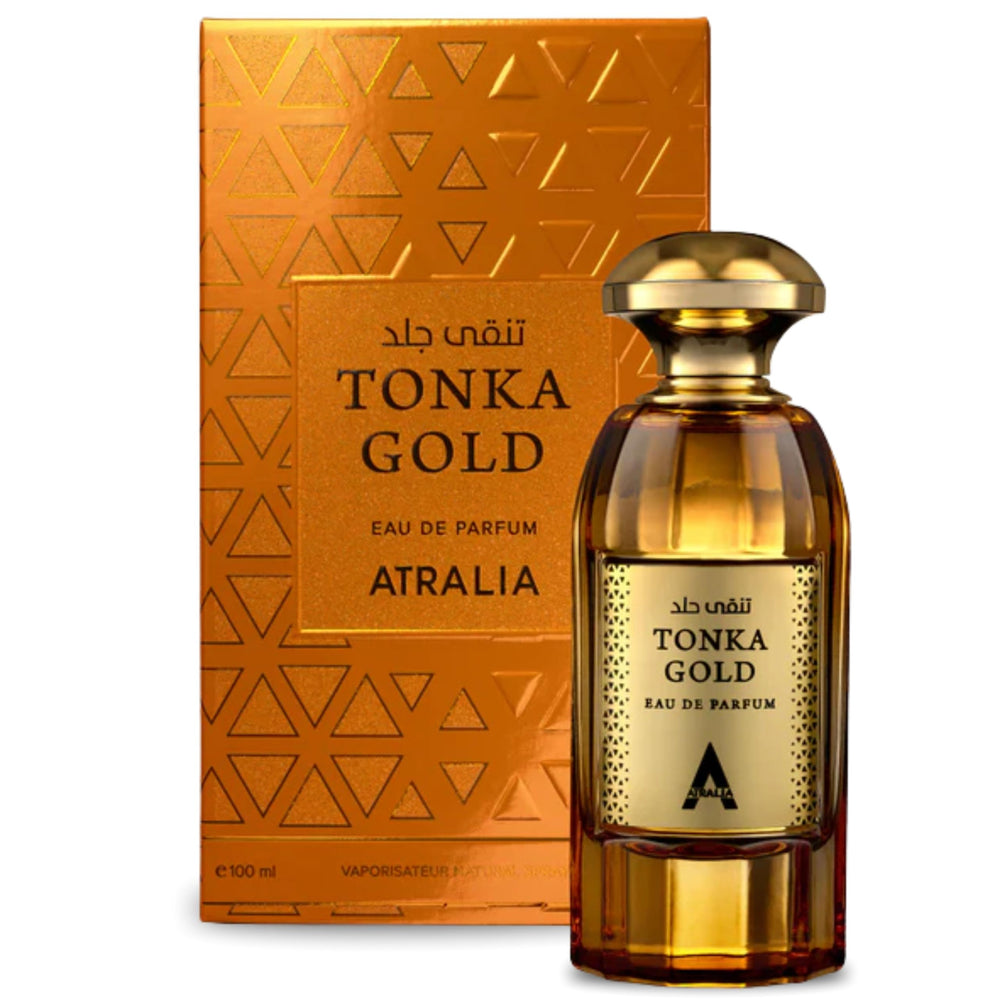 Atralia Tonka Gold Eau De Parfum bottle glows amber for elegant evenings
