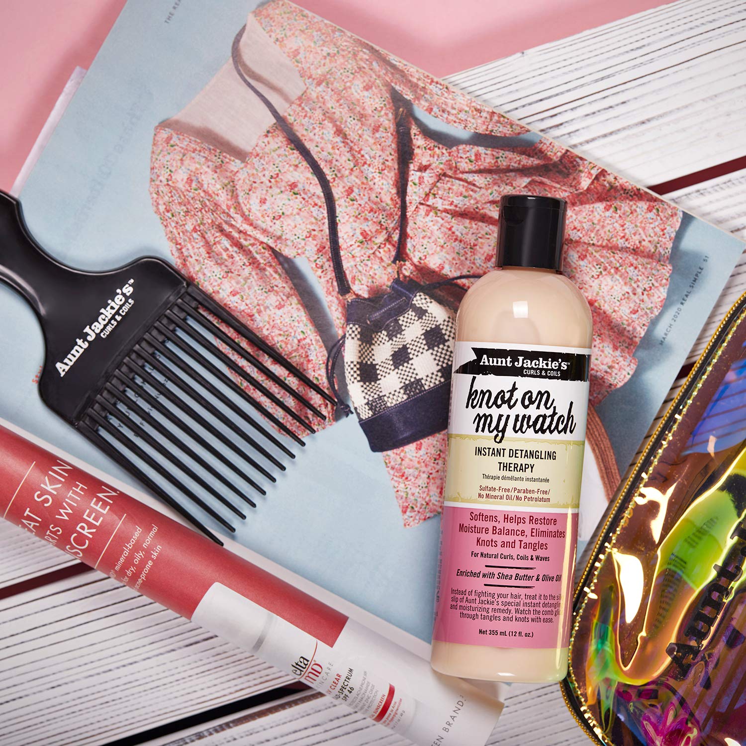 Shea butter and olive oil nourish strands during detangling with Knot On My Watch.