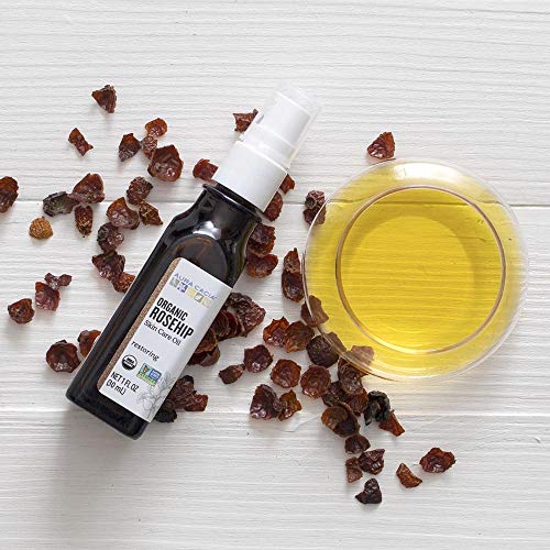 Aura Cacia Rosehip Oil texture closeup highlights lightweight, fast-absorbing moisture.
