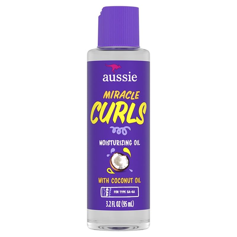 Aussie Miracle Curls Defining Oil on hair showing sleek hydrated curls.