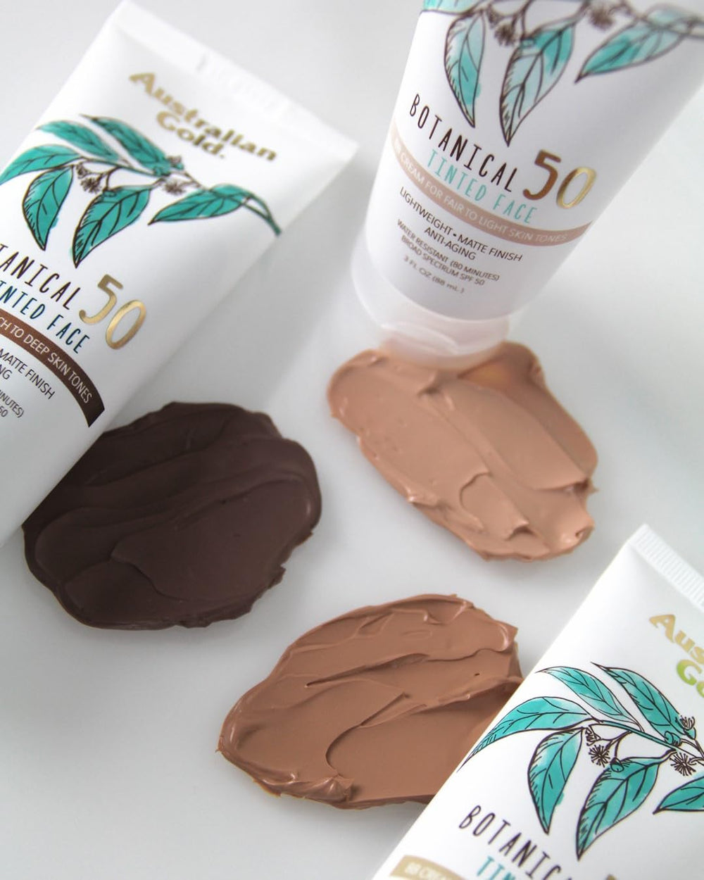 Australian Gold Botanical SPF 50 tinted face lotion texture closeup shows powdery matte finish.