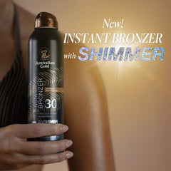 Australian Gold bronzer spray with shimmer creates instant glow during beach outings