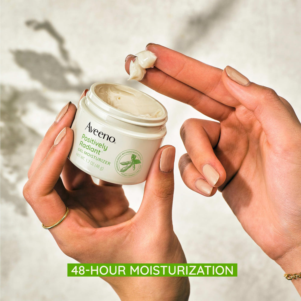 Aveeno Positively Radiant tone-correcting soy label closeup signals tone-evening potential.