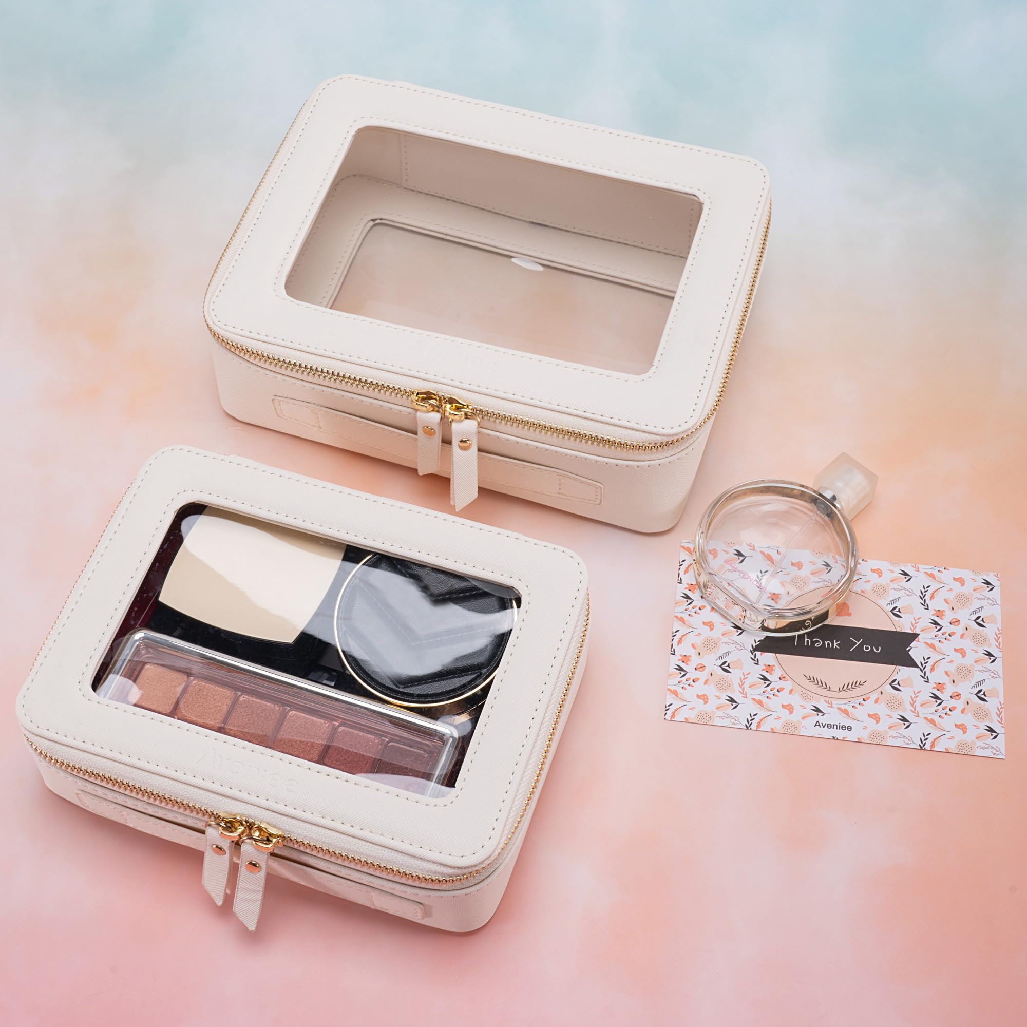 Aveniee Clear makeup bag organized inside for neat cosmetics storage.