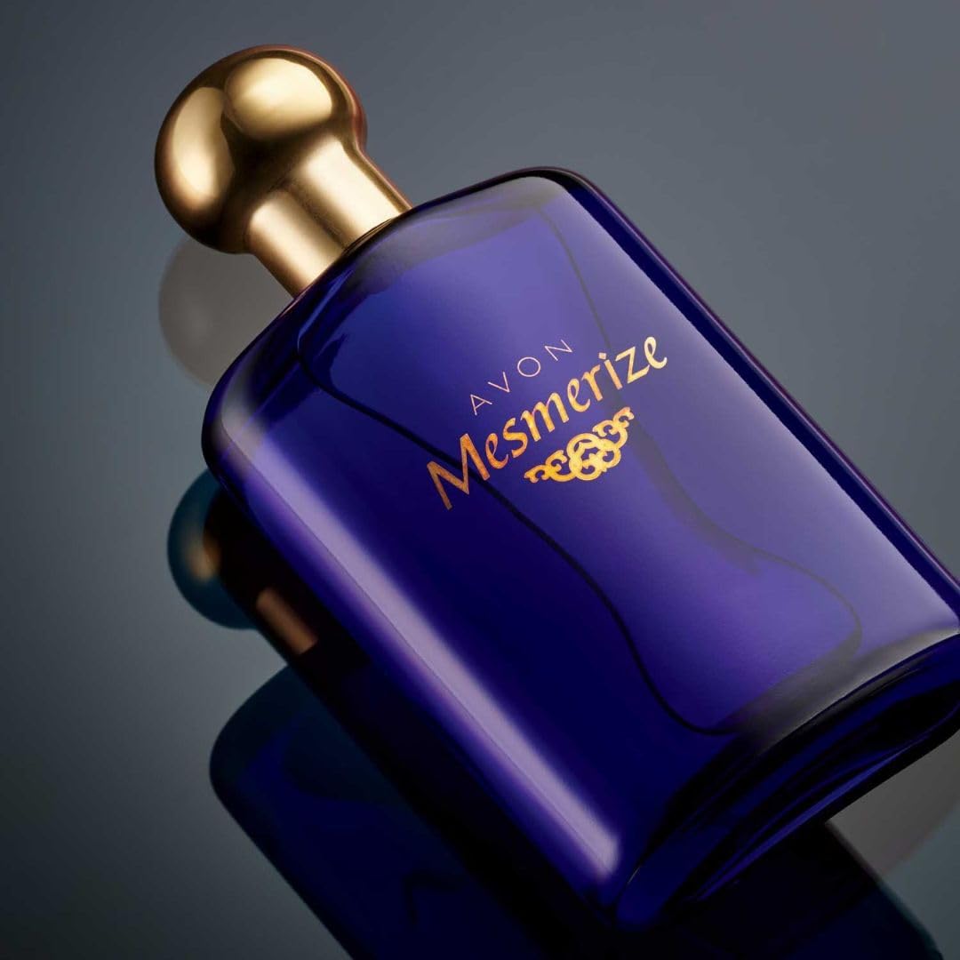 AVON Mesmerize being applied to wrist demonstrates long-lasting wear.