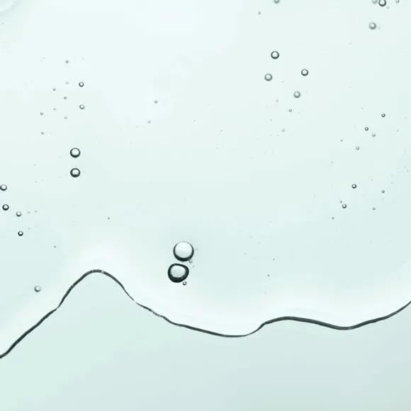 AVON Skin So Soft Original Bath Oil pour demonstrates easy, soothing post-bath use