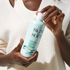 Avon Skin So Soft Original Body Lotion being applied on arm for quick comfort.