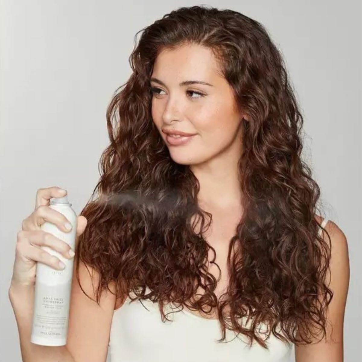 Awapuhi Wild Ginger humidity shield spray bottle delivering frizz defense for humid days.