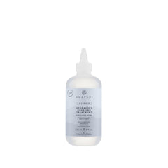 Awapuhi Wild Ginger HydraSoft glossing bottle pouring for instant shine