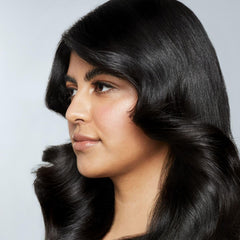 Awapuhi Wild Ginger Styling Treatment Oil closeup-hair highlights shine and sealed strands.