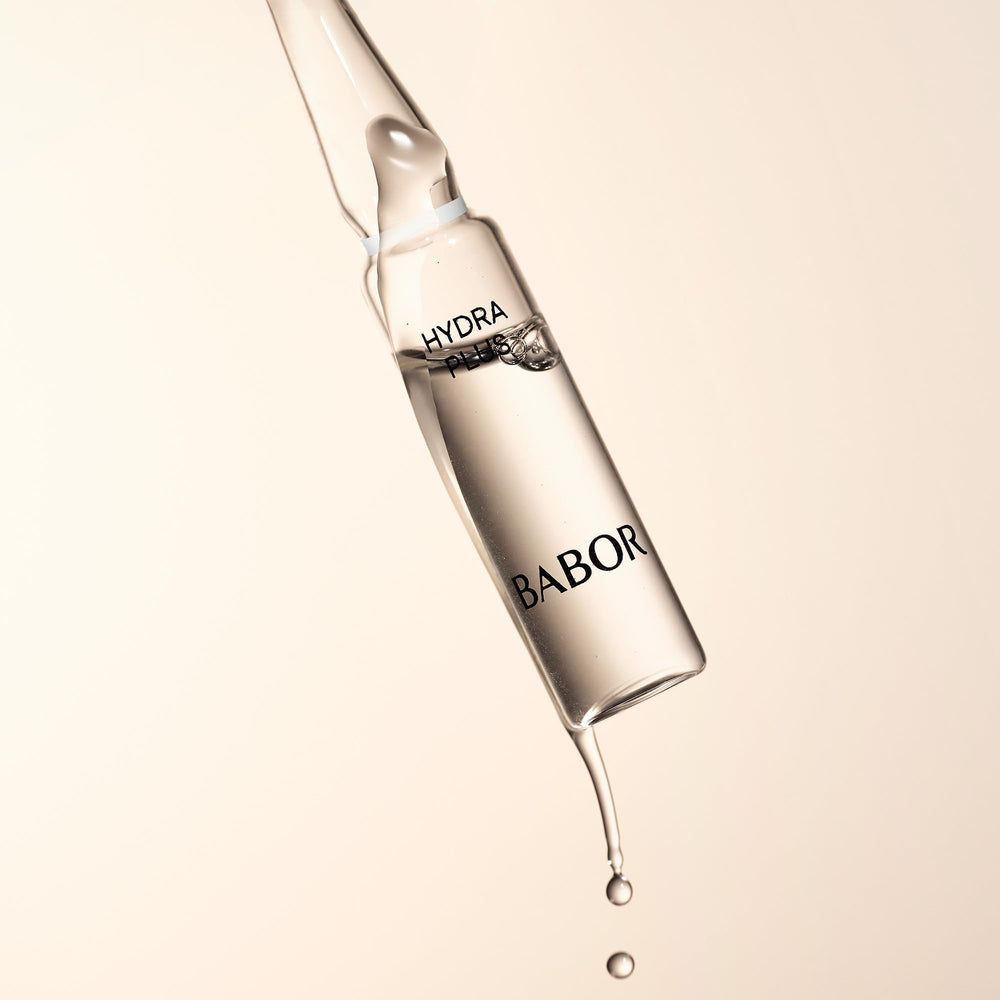 BABOR Hydra Plus Ampoules on vanity with towel suggesting refreshing skincare ritual