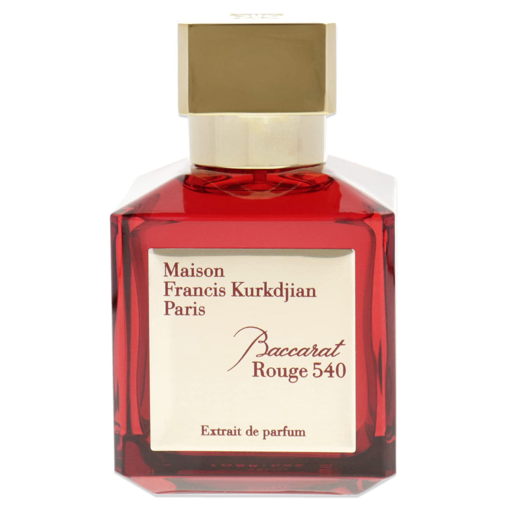 Baccarat Rouge 540 glass bottle on mirror emphasizes radiant glow and wearable luxury.