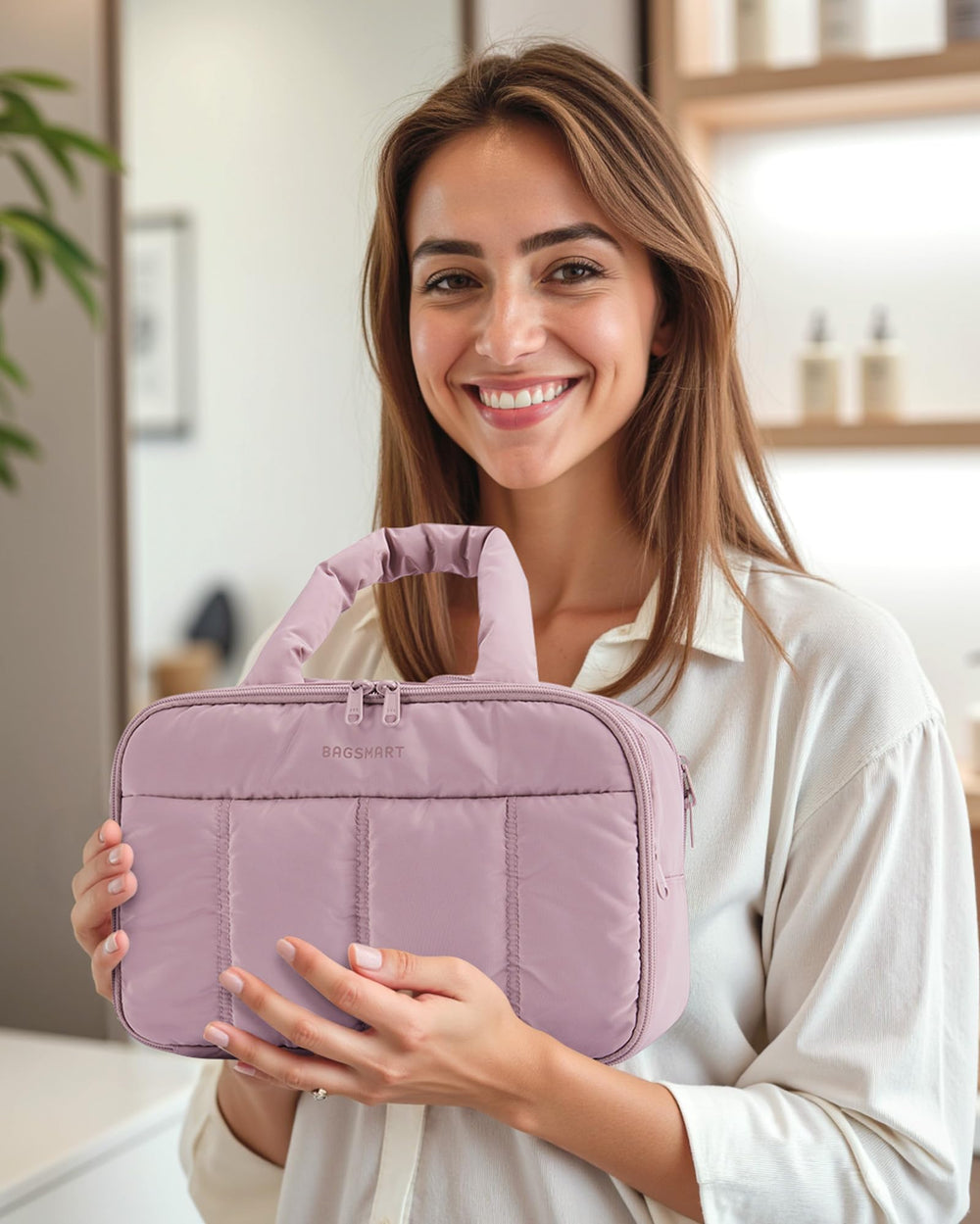 BAGSMART Puffy Toiletry Bag purple handle close-up highlights soft, pressure-relieving carry.