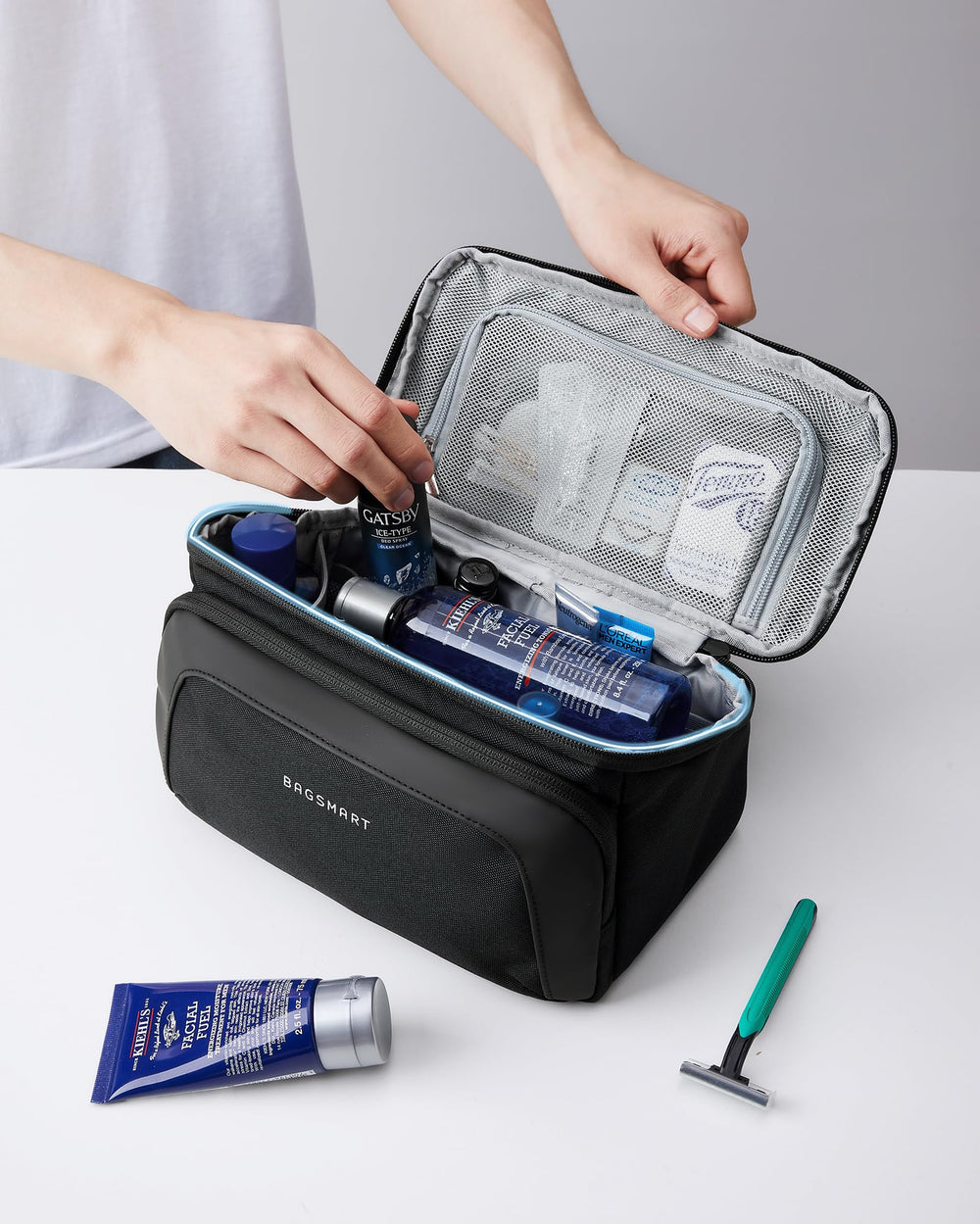 BAGSMART toiletry bag navy lay-flat open demonstrates easy access to toiletries.
