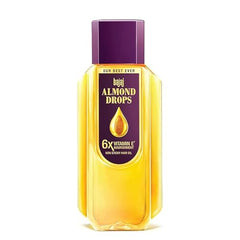 Bajaj Almond Drops bottle side view highlighting compact packaging for convenient use