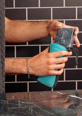 Ballsy Handy Shower Tool shown with related Ballsy bars for a seamless routine