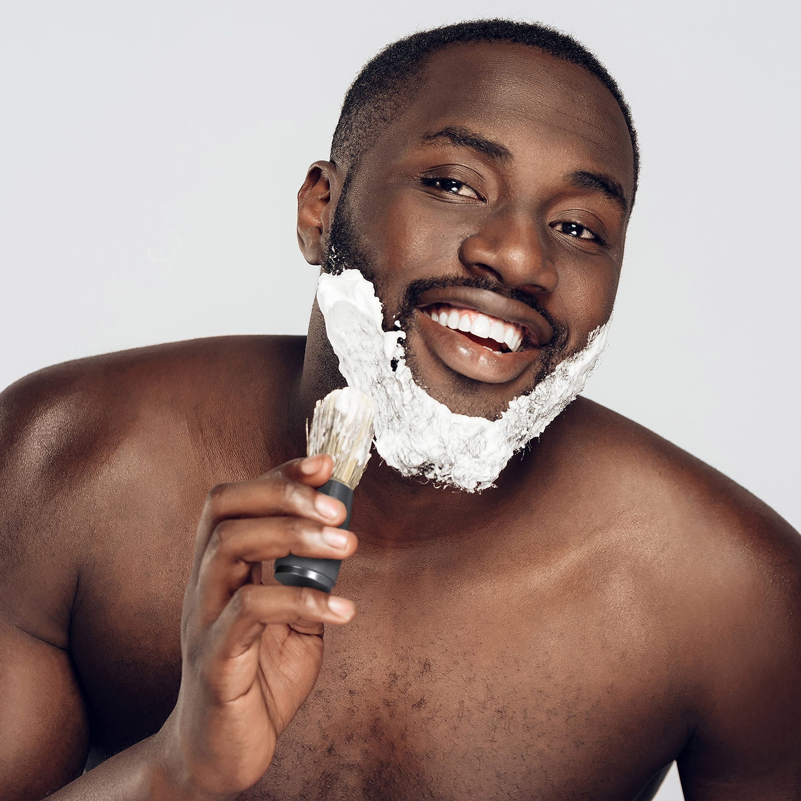 Bambaw shaving brush in travel setup shows compact, durable daily carry.