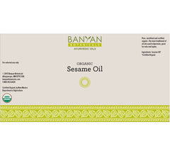 Banyan Botanicals Sesame Oil amber glass jar close-up shows golden unrefined quality
