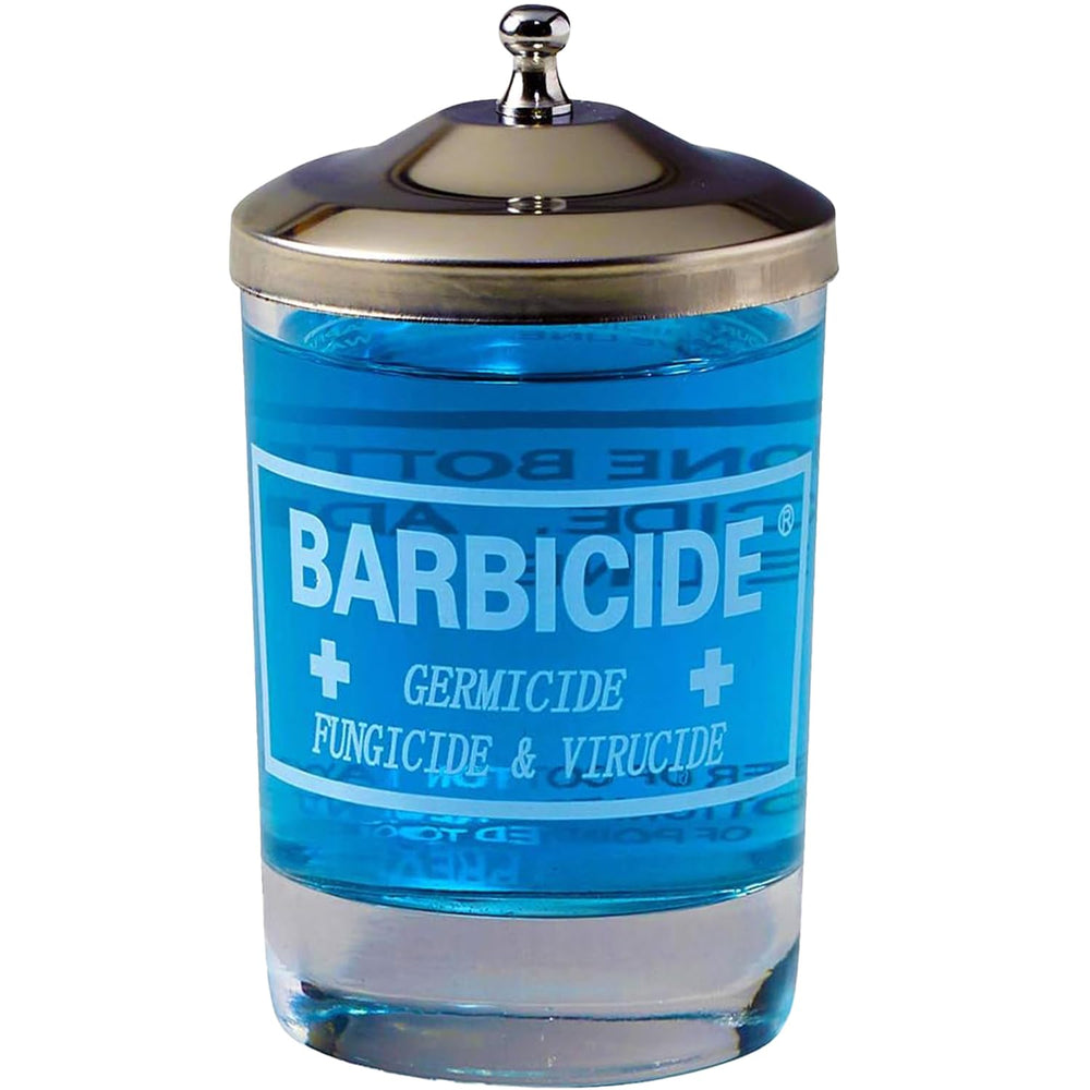 Barbicide disinfecting jar clear glass shows disinfectant level for quick tool sanitization.