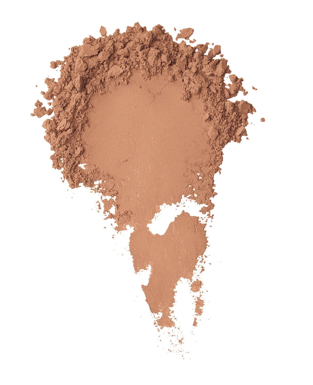 BareMinerals loose powder concealer Honey Bisque applied with brush for precise spot correction
