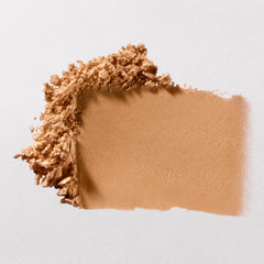 bareMinerals Original Pressed Mineral Veil Sheer Tan on skin reduces visible pores.