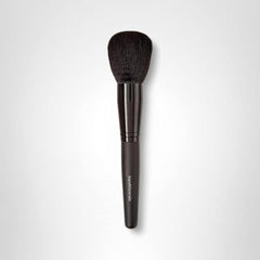 bareMinerals Supreme Finisher brush with waved fibers delivers even distribution for finishing powders.