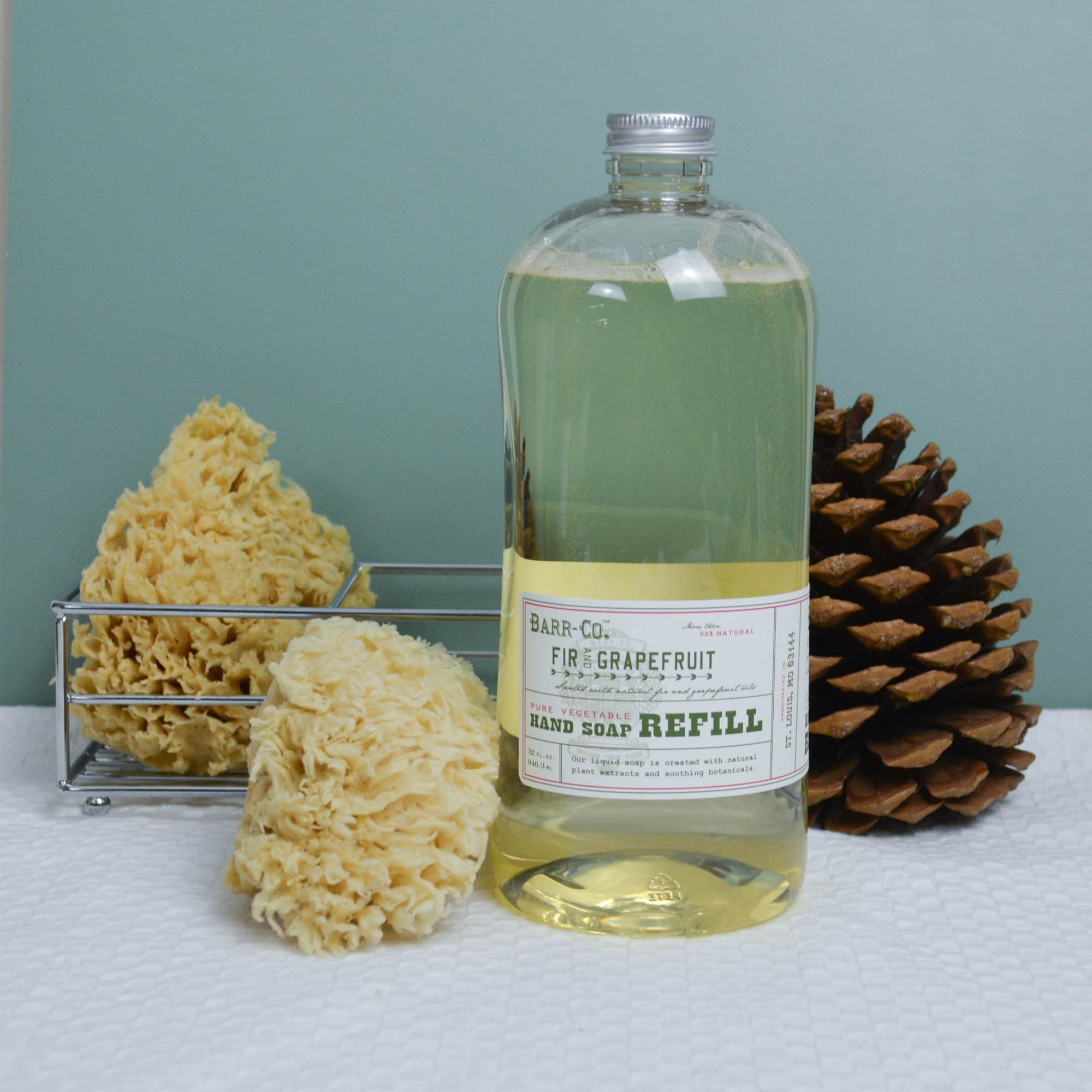 BARR-CO hand soap refill pour into dispenser demonstrating simple, mess-free setup.
