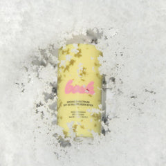 Bask SPF 50 sunscreen stick used on gloved hand to illustrate twist-up convenience.